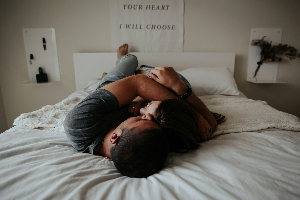 couple laying on bed