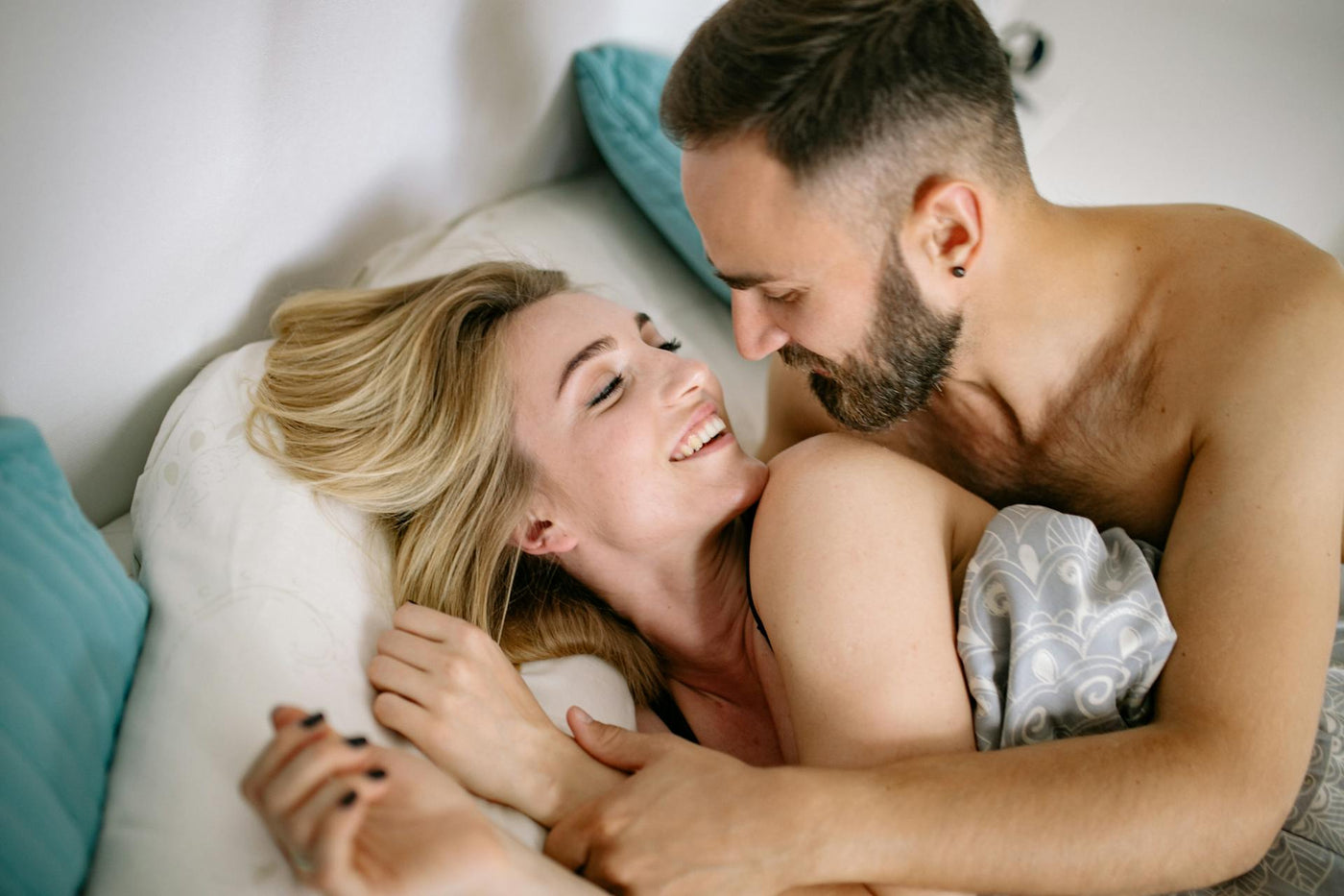 Intimate couple on bed