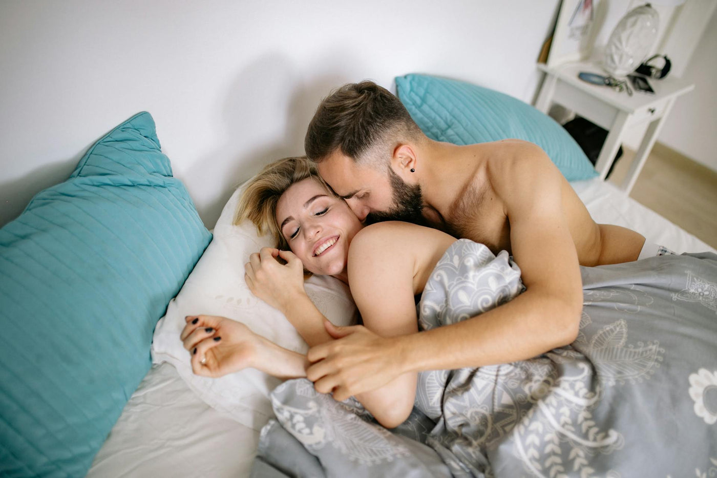 happy couple on bed