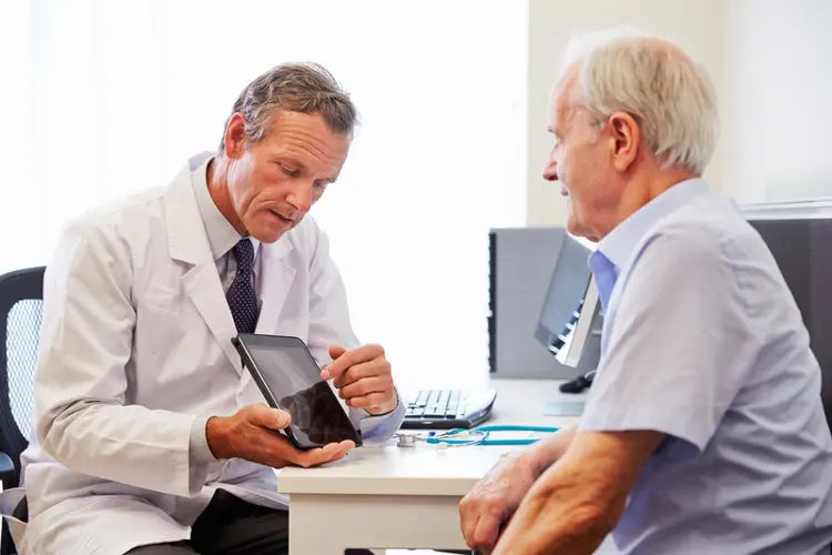 doctor is explaining to old man