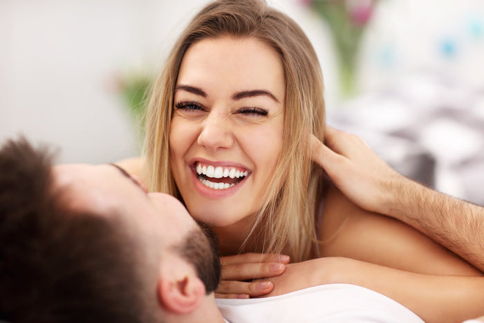 Adult attractive couple in bed