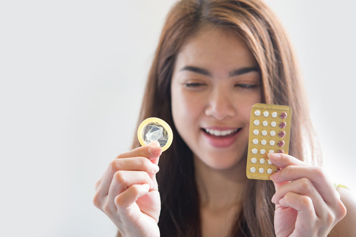 A girl holding pills