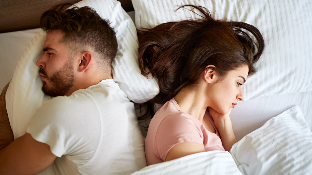 men and women on bed