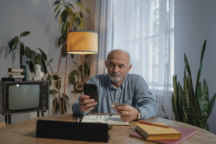 old man using phone
