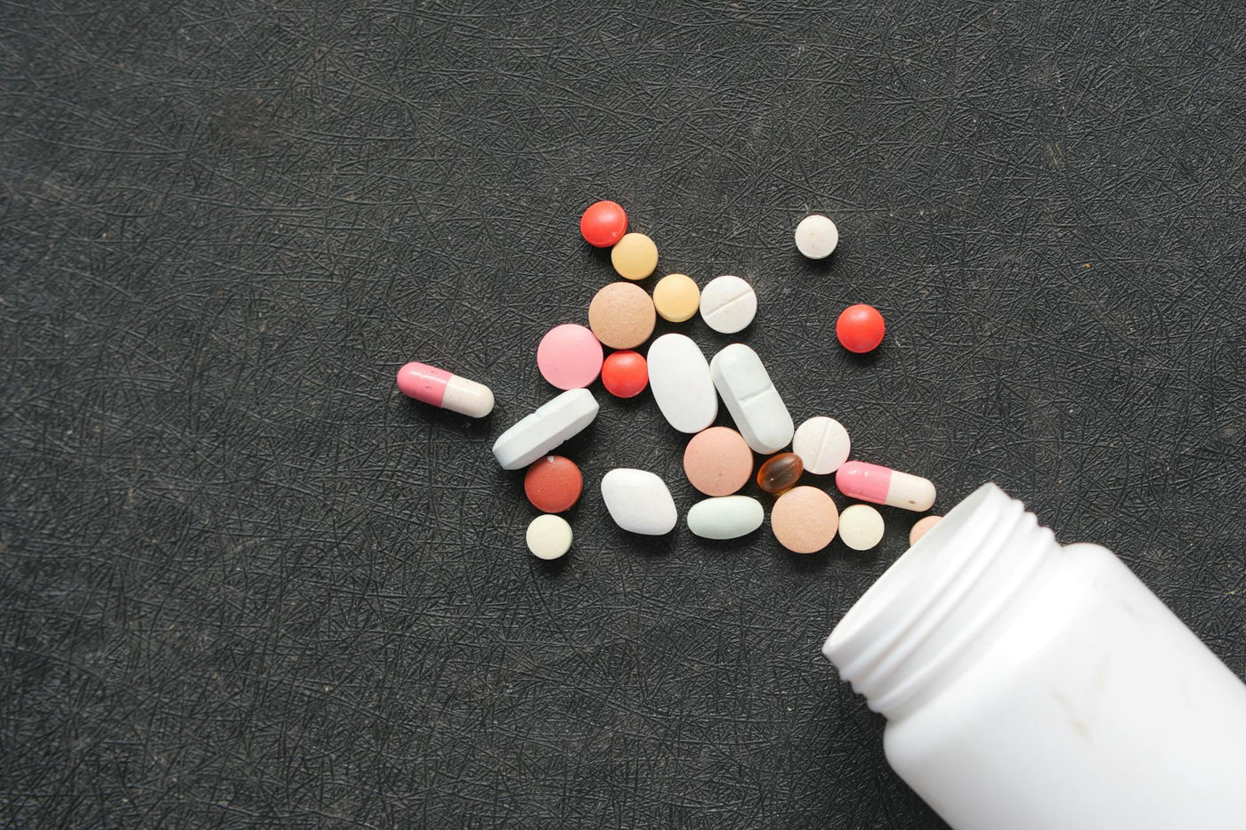 Medication Pills on Black Surface