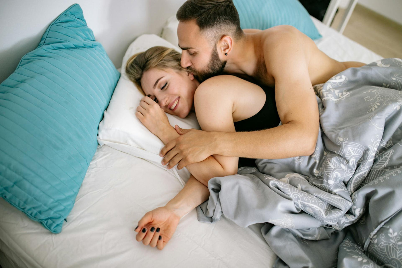 happy couple on bed