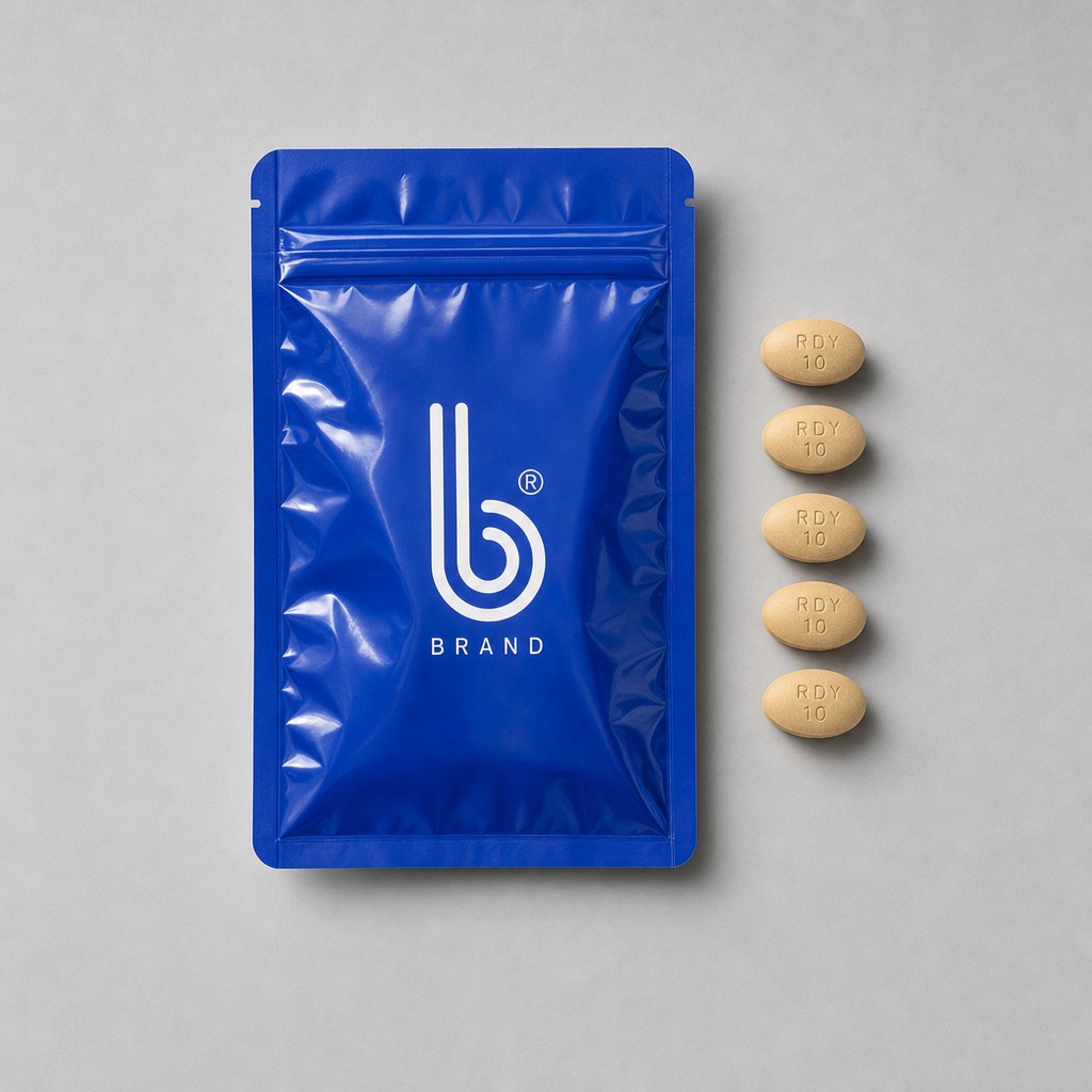 Tadalafil pouch laid flat next to five 10mg tablets
